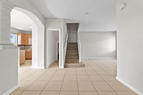 a view of a entryway with stairs and a cabinet