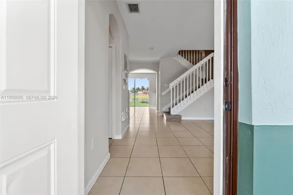 a view of entryway and hall with a window