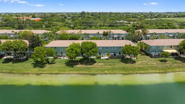 an aerial view of a house with outdoor space