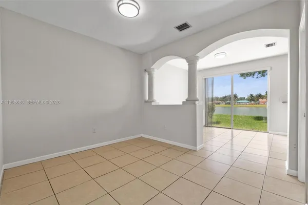 a view of an empty room and window