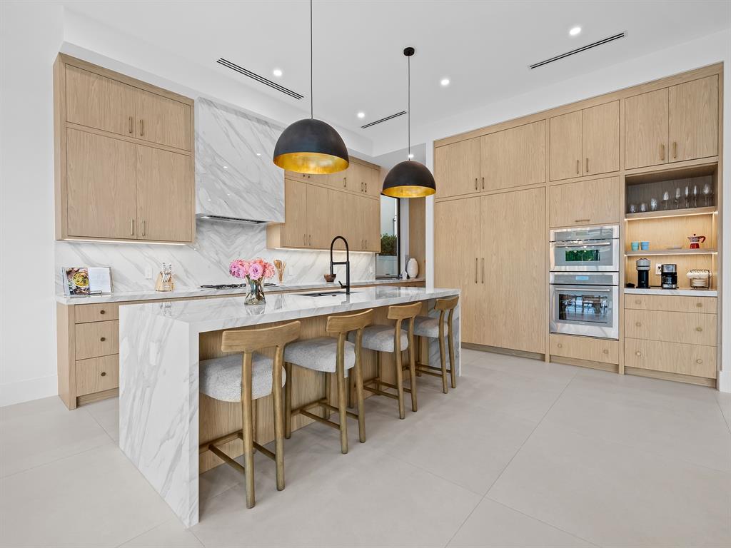 2420 Northeast 48th Street Lighthouse Point, FL 33064 - Photo 12 of 51 a kitchen with a sink cabinets and window