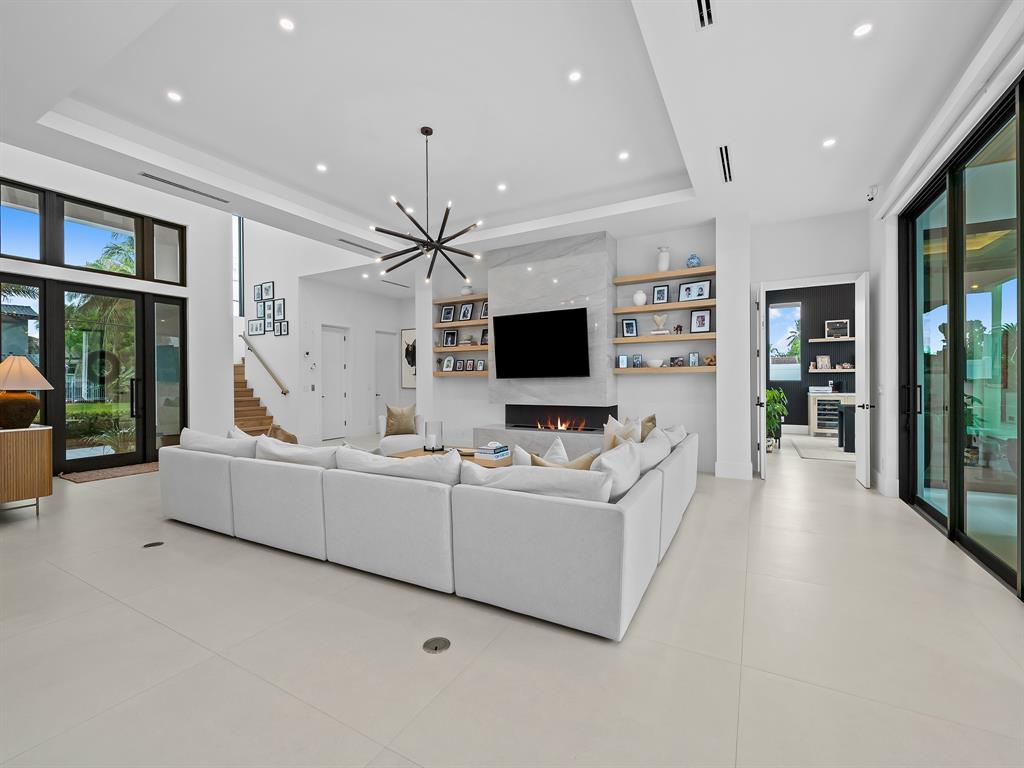 2420 Northeast 48th Street Lighthouse Point, FL 33064 - Photo 16 of 51 a living room with furniture and a flat screen tv