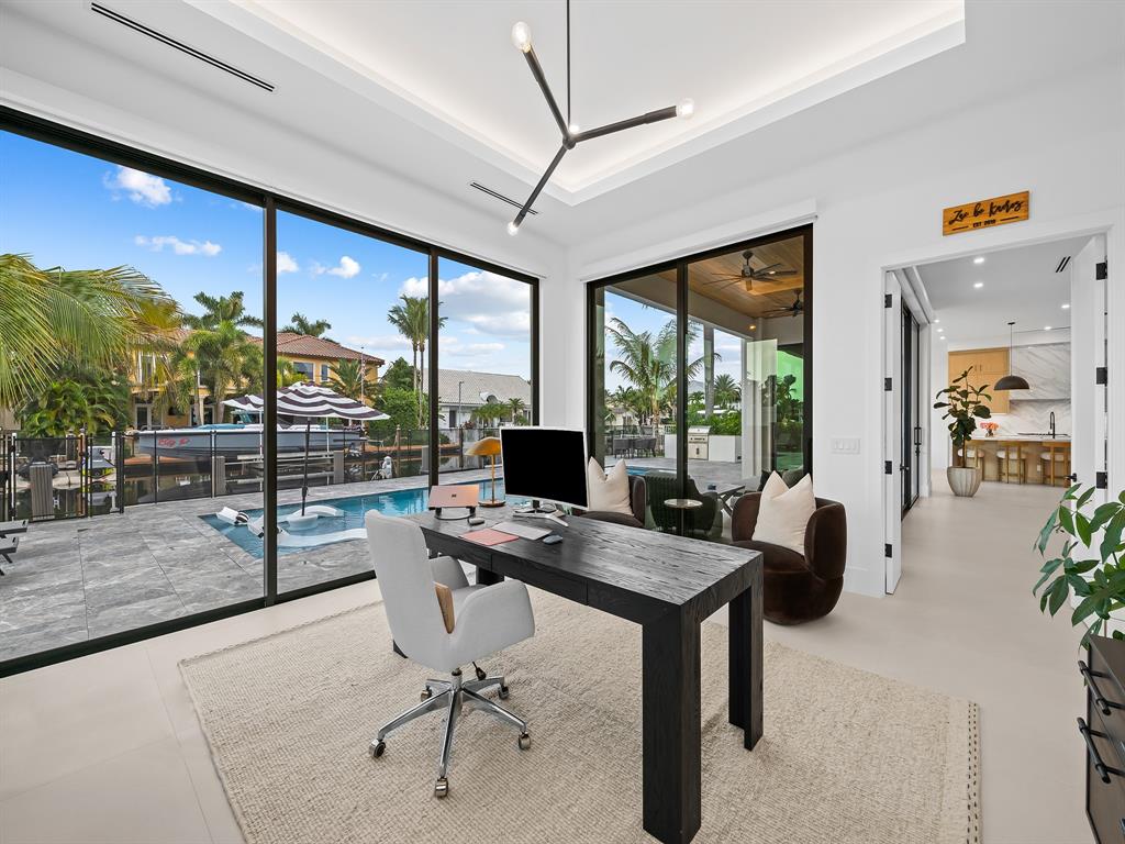 2420 Northeast 48th Street Lighthouse Point, FL 33064 - Photo 19 of 51 a workspace with furniture and a window