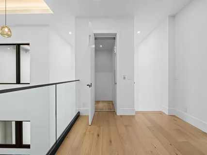 a view of entryway with wooden floor