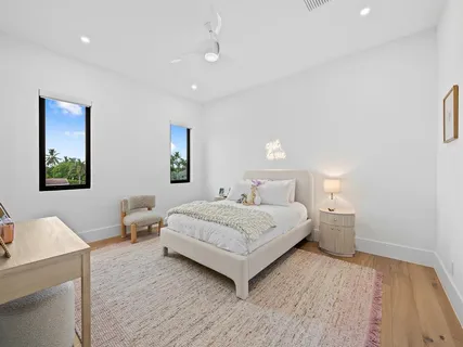 a spacious bedroom with a bed and a couch