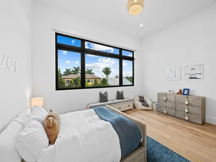 a bedroom with a bed and window