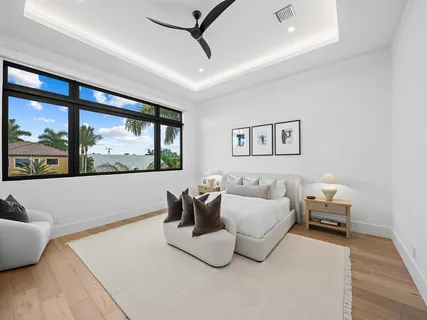 a living room with furniture and large window