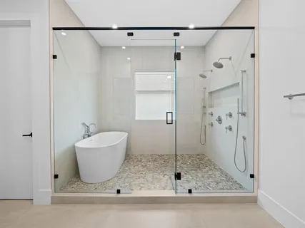 a bathroom with a shower and a sink