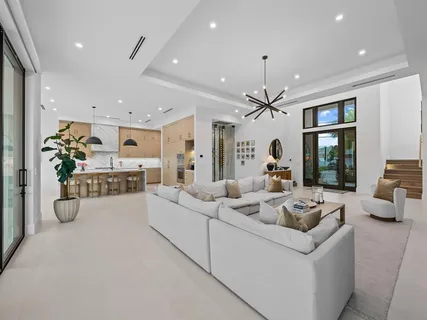 a living room with furniture and white walls