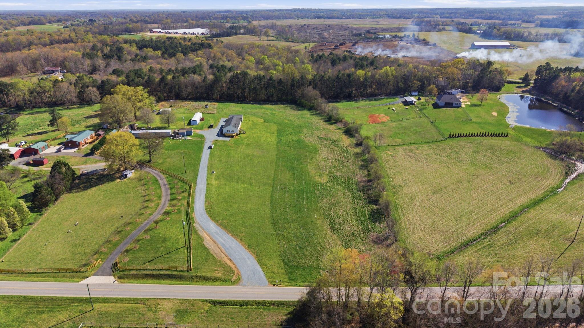 3010 Old Monroe Marshville Road Wingate, NC 28174 - Photo 2 of 44 an aerial view of a residential houses with outdoor space and trees