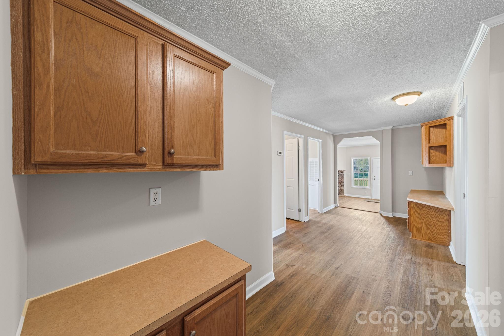 3010 Old Monroe Marshville Road Wingate, NC 28174 - Photo 21 of 44 a view of a room with wooden floor and cabinet