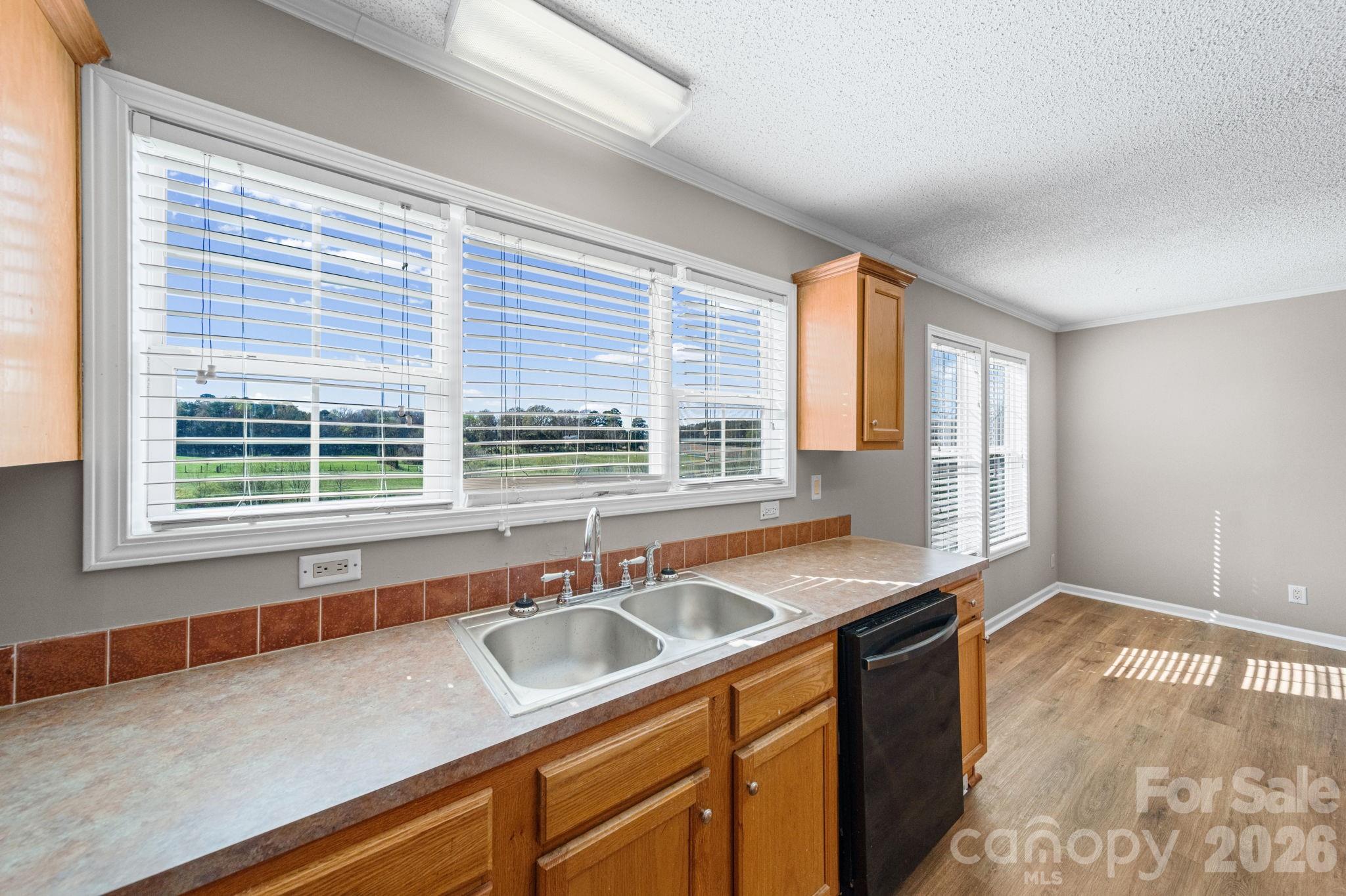 3010 Old Monroe Marshville Road Wingate, NC 28174 - Photo 22 of 44 a kitchen with a sink and a window