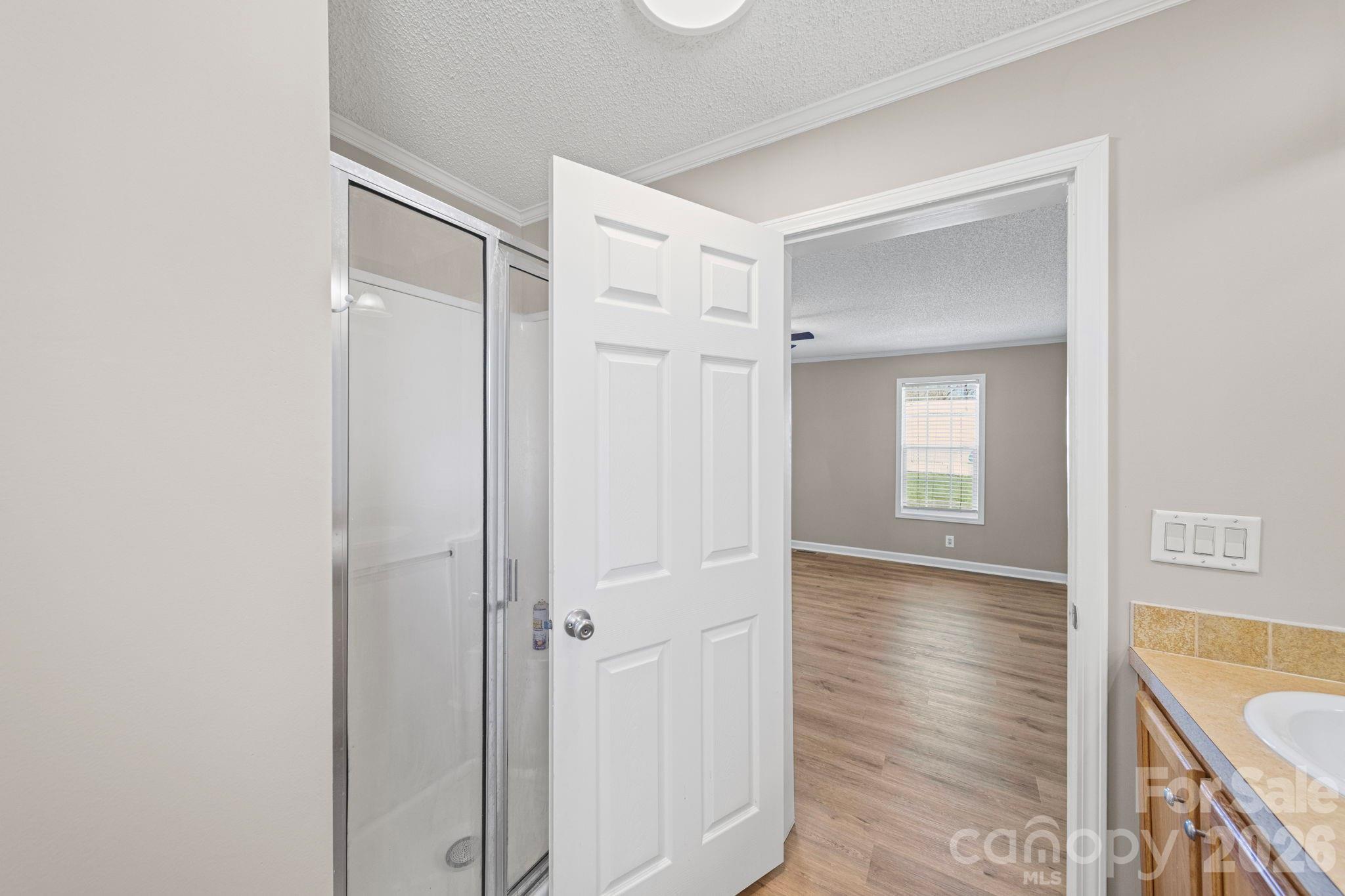 3010 Old Monroe Marshville Road Wingate, NC 28174 - Photo 33 of 44 a view of an empty room with window and wooden floor