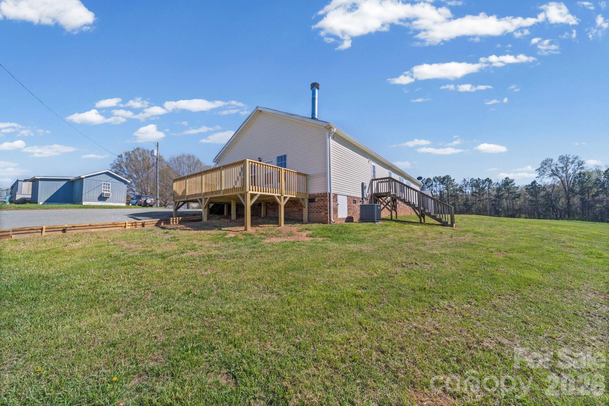3010 Old Monroe Marshville Road Wingate, NC 28174 - Photo 8 of 44 a view of a house with a big yard