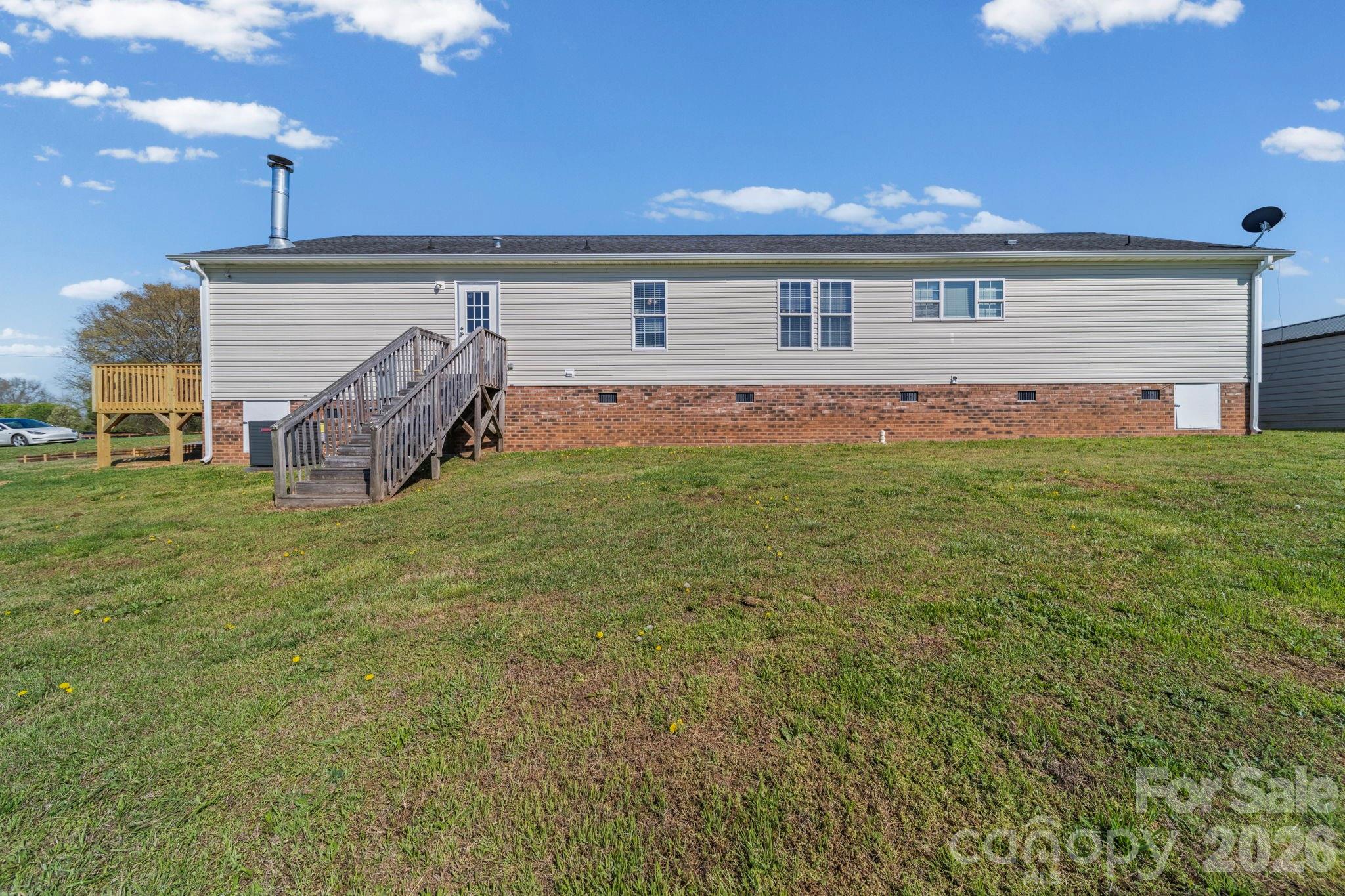3010 Old Monroe Marshville Road Wingate, NC 28174 - Photo 9 of 44 a view of a house with backyard