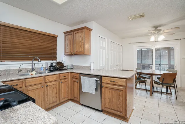 a kitchen with a sink and cabinets