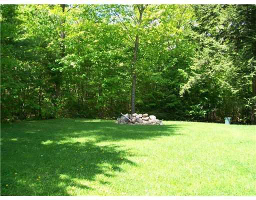 210 Dunton Road Naples, ME 04055 - Photo 6 of 17 Yard/Garden. Backyard w/ fire pit