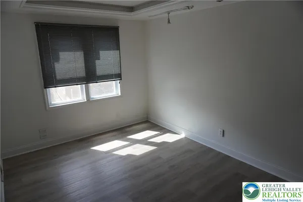 a view of an empty room and window