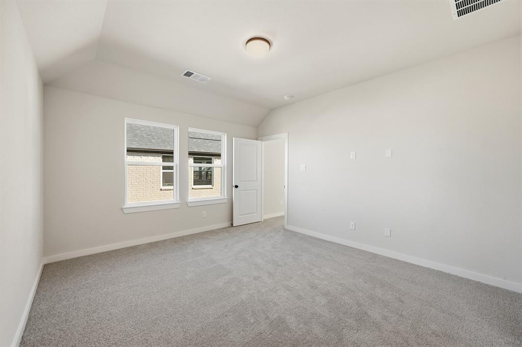 4409 Script Street Prosper, TX 75078 - Photo 11 of 24 a view of an empty room with a window