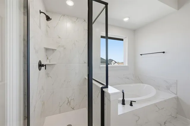 a view of a livingroom with wooden floor and a large window