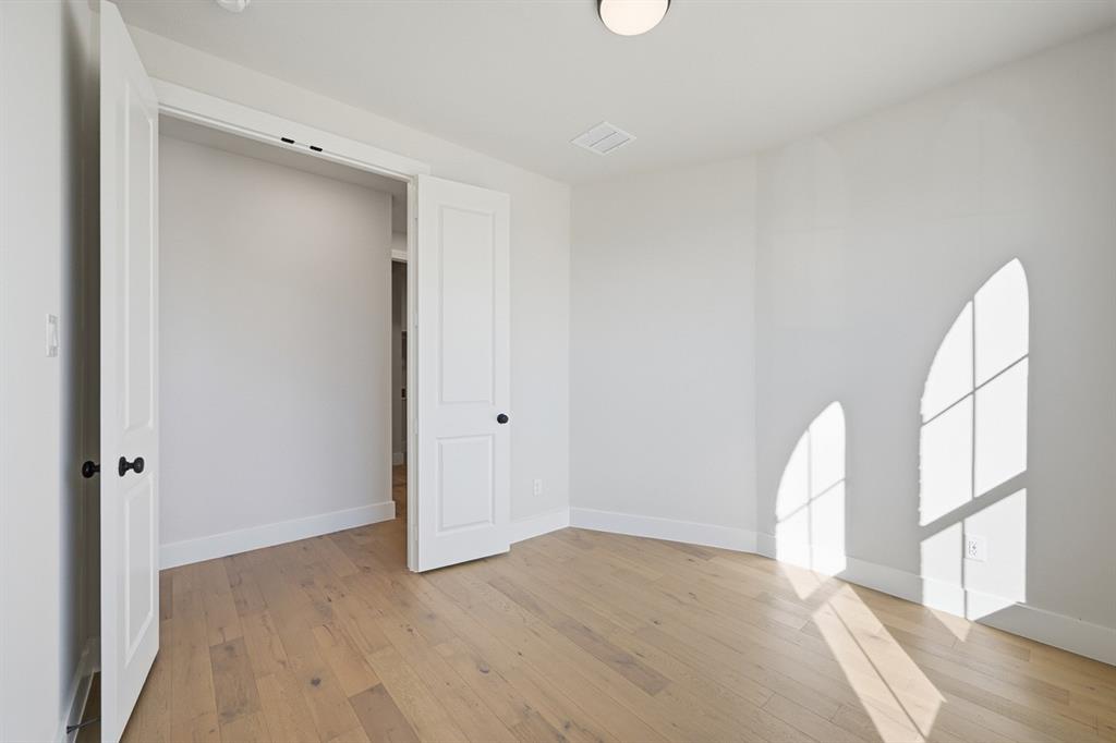 4409 Script Street Prosper, TX 75078 - Photo 16 of 24 a view of a room with wooden floor and a large window