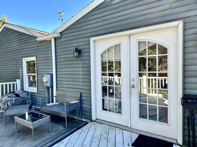 a balcony with furniture and windows
