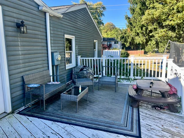 a view of a deck with furniture