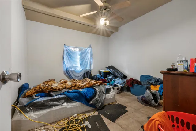 a bedroom with furniture and a bed