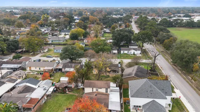 an aerial view of residential houses with outdoor space