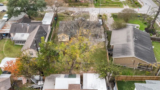 an aerial view of a house with a lake view