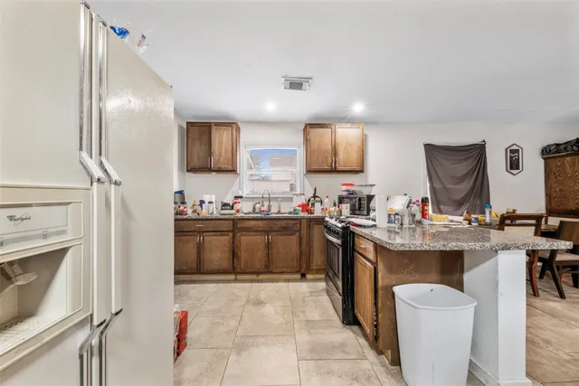 a kitchen with sink cabinets and window