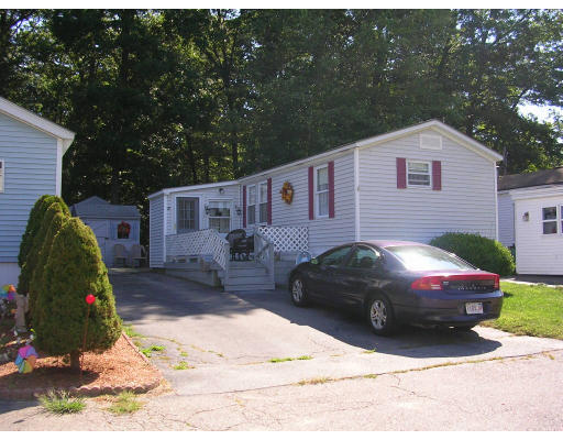25 Groton School Road, Unit 20 Ayer, MA 01432 - Photo 1 of 1 a front view of a house with a yard