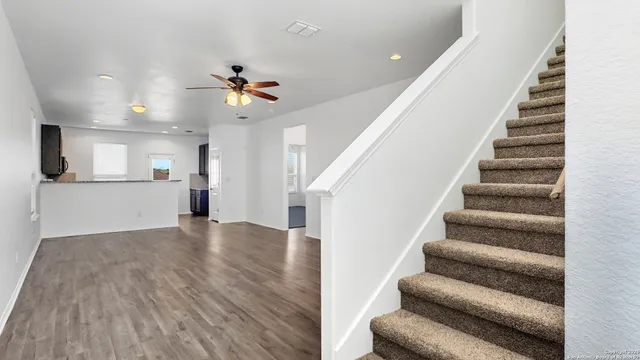 a view of an entryway with wooden floor