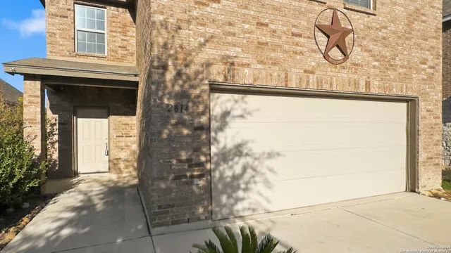 a front view of a house with a glass door