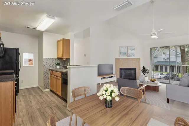 a living room with furniture fireplace and flat screen tv