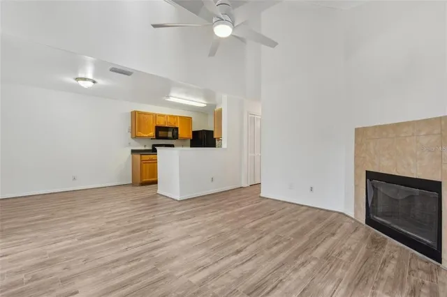 a view of kitchen and hall with wooden floor