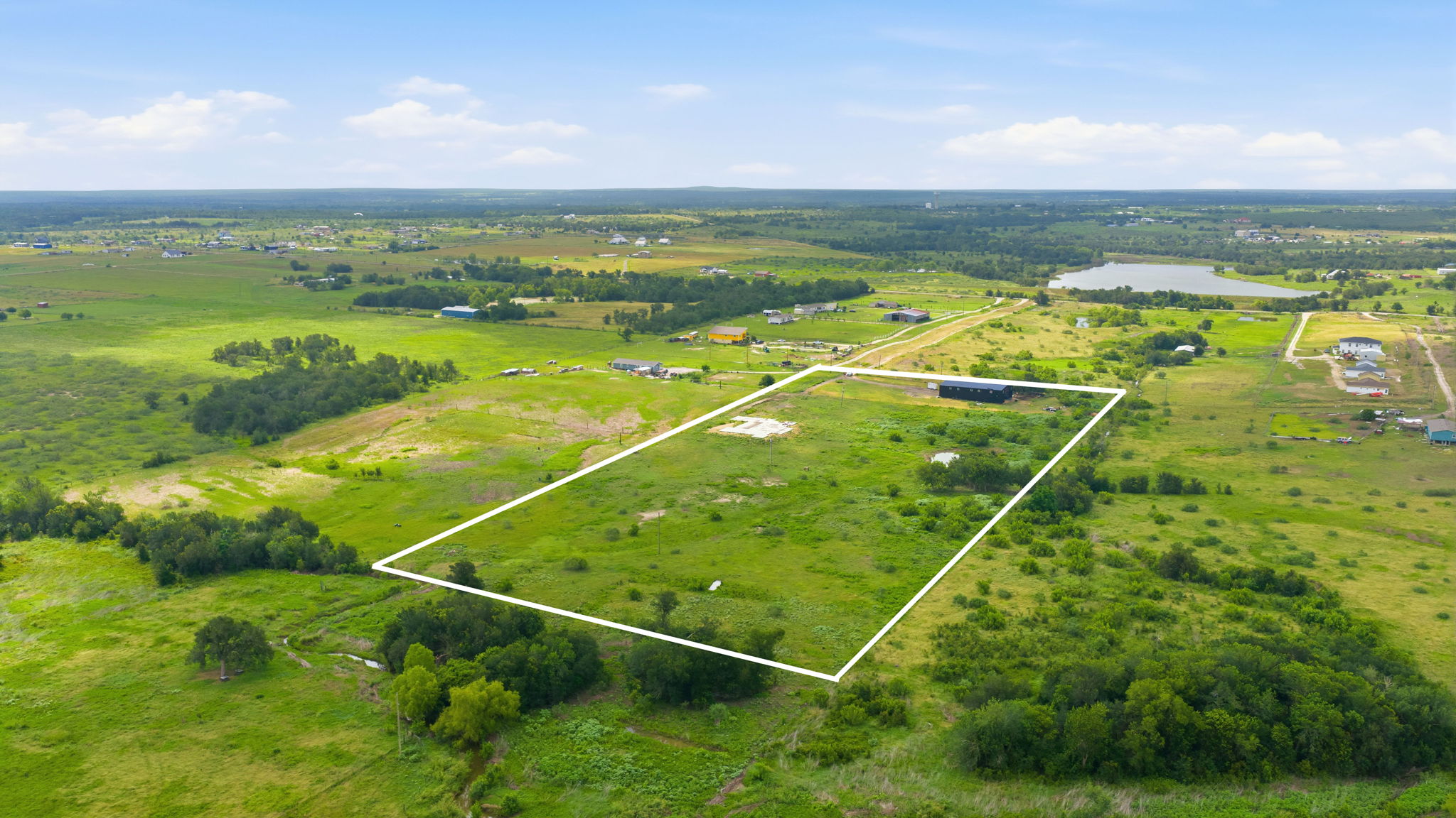 1701 County Road 466 Elgin, TX 78621 - Photo 24 of 24 Panoramic views stretch over this vast, verdant lot, ideal for diverse development.