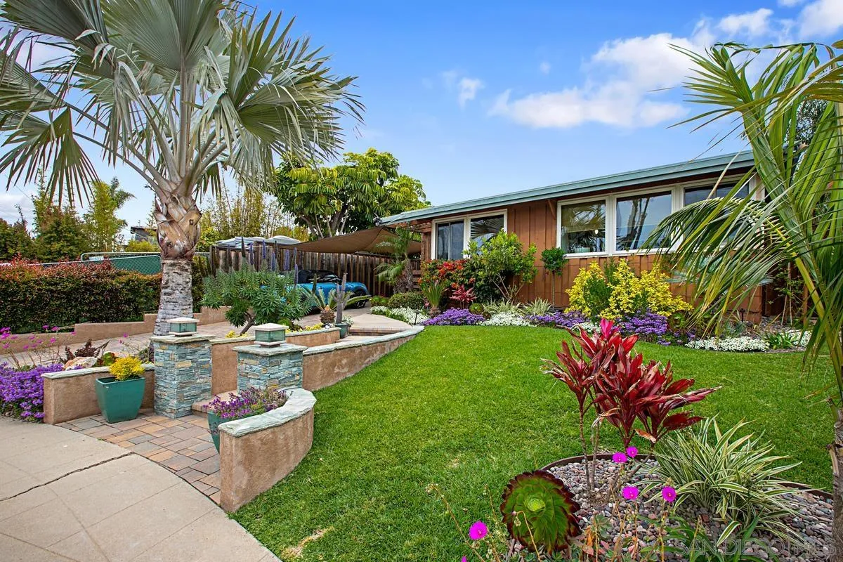 6243 Dowling Drive La Jolla, CA 92037 - Photo 1 of 28 a view of a backyard with sitting area and garden