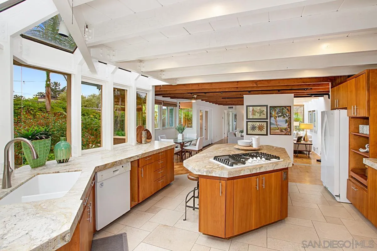 6243 Dowling Drive La Jolla, CA 92037 - Photo 11 of 28 a kitchen with a stove a sink and a refrigerator