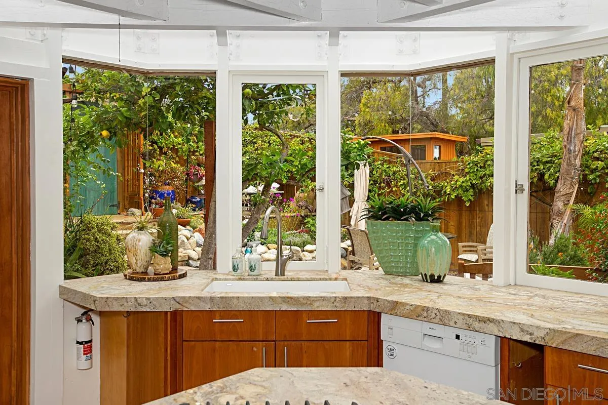 6243 Dowling Drive La Jolla, CA 92037 - Photo 13 of 28 a view of kitchen with granite countertop a sink and potted plant