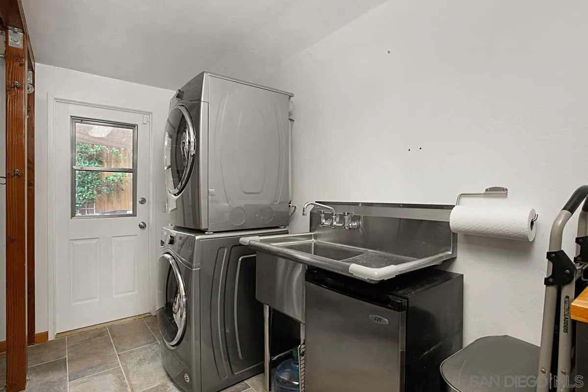 6243 Dowling Drive La Jolla, CA 92037 - Photo 15 of 28 a utility room with dryer and washer