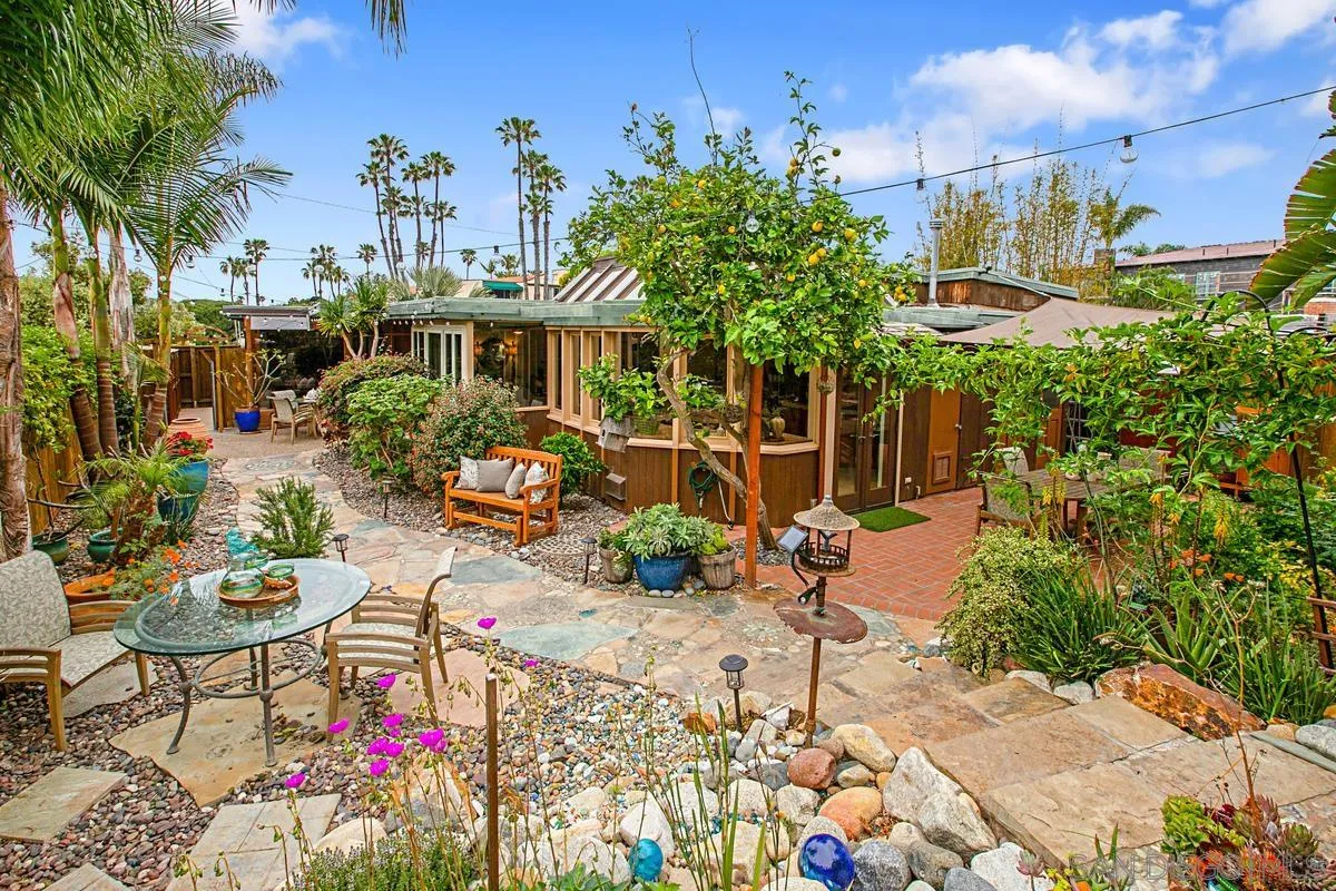 6243 Dowling Drive La Jolla, CA 92037 - Photo 25 of 28 a view of a chairs and table in a backyard