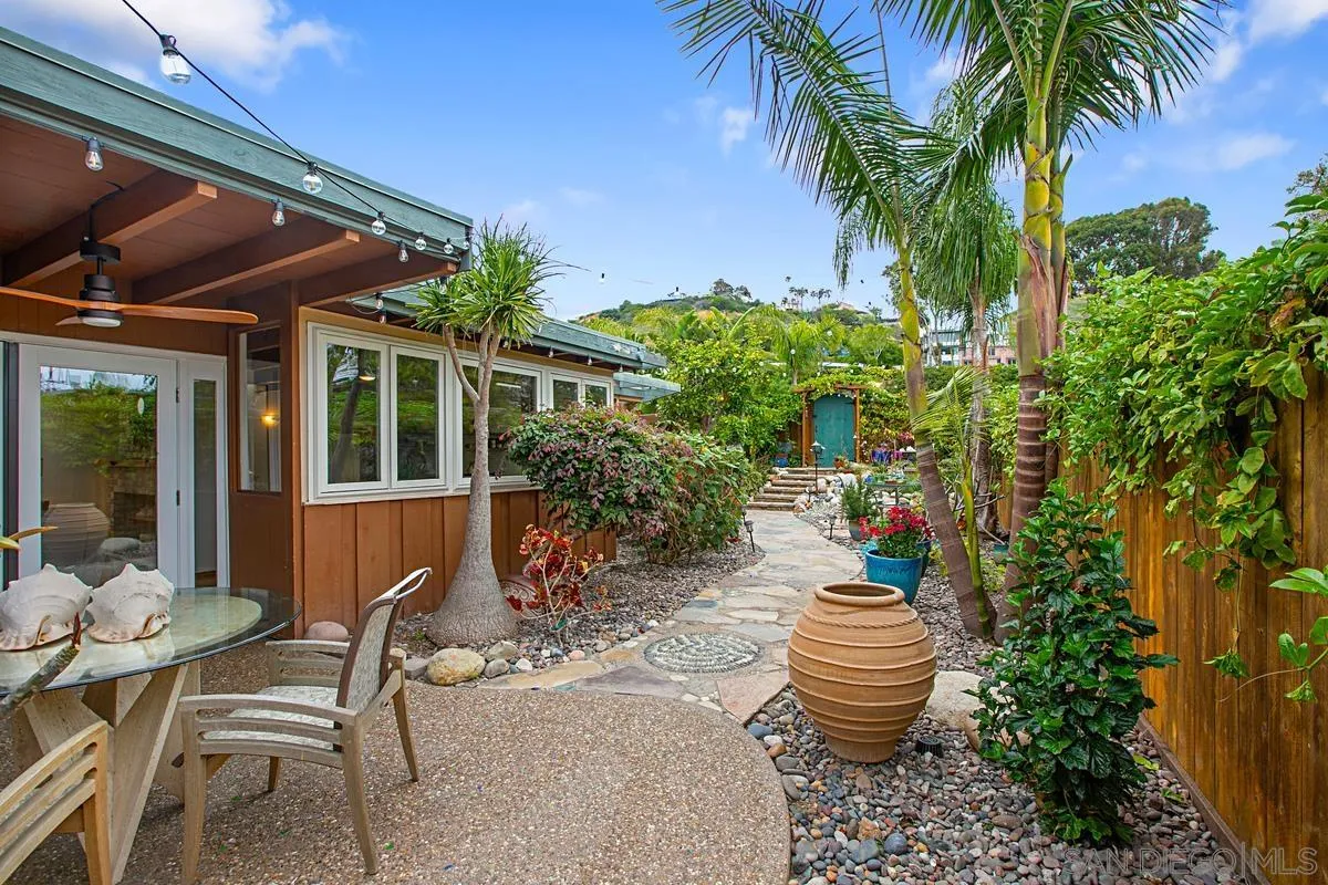 6243 Dowling Drive La Jolla, CA 92037 - Photo 28 of 28 a view of a chair and table in backyard