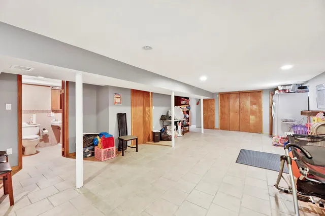 a view of a livingroom with couch and a large window
