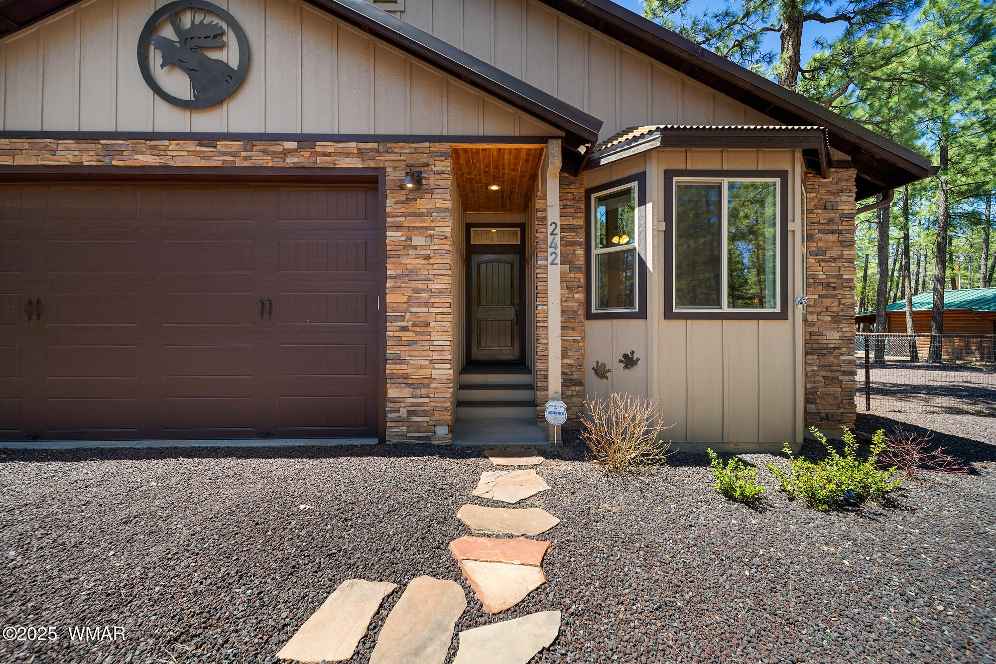 242 Frog Island Road Lakeside, AZ 85929 - Photo 23 of 28 Knotty Alder front door & 10' garage door