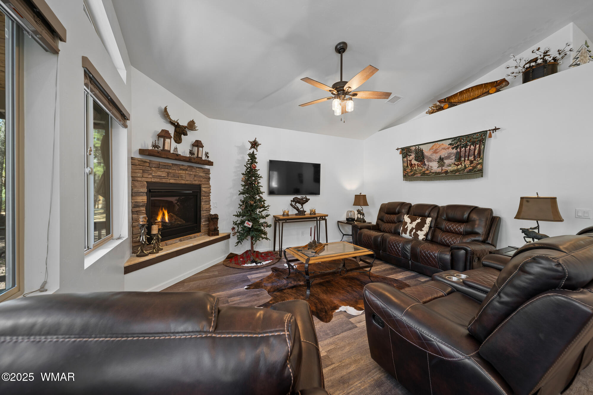 242 Frog Island Road Lakeside, AZ 85929 - Photo 4 of 28 Gas fireplace with stone, custom mantle & hearth
