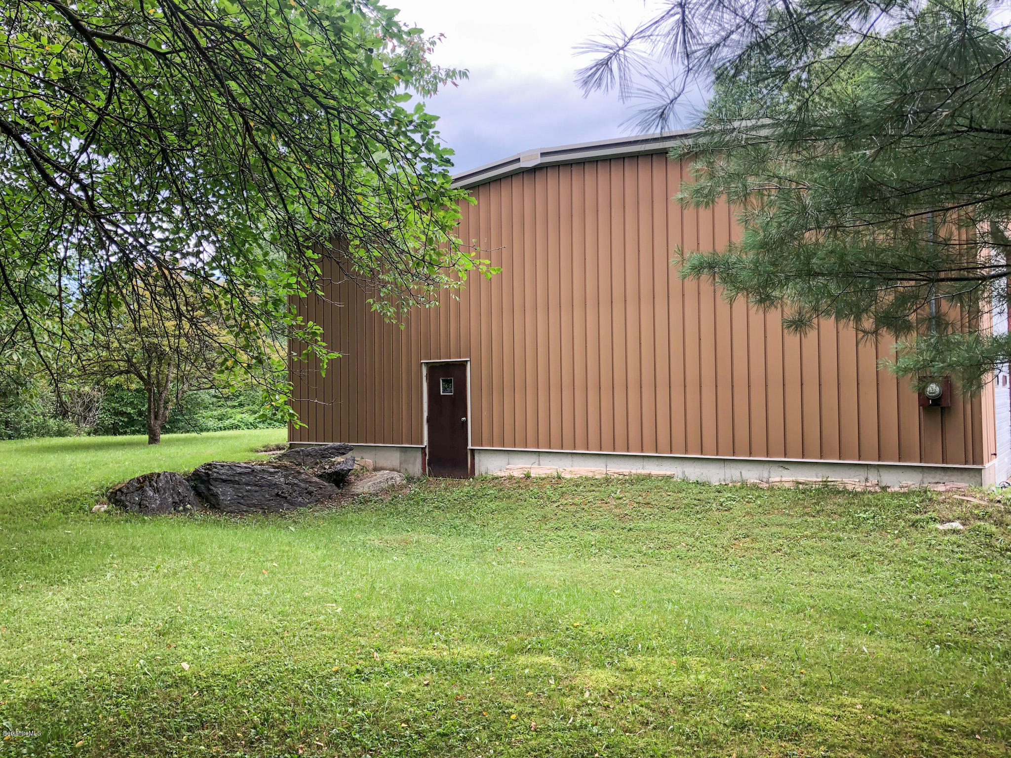 93 Lower Valley Road Washington, MA 01223 - Photo 2 of 15 a backyard of a house with plants and large tree