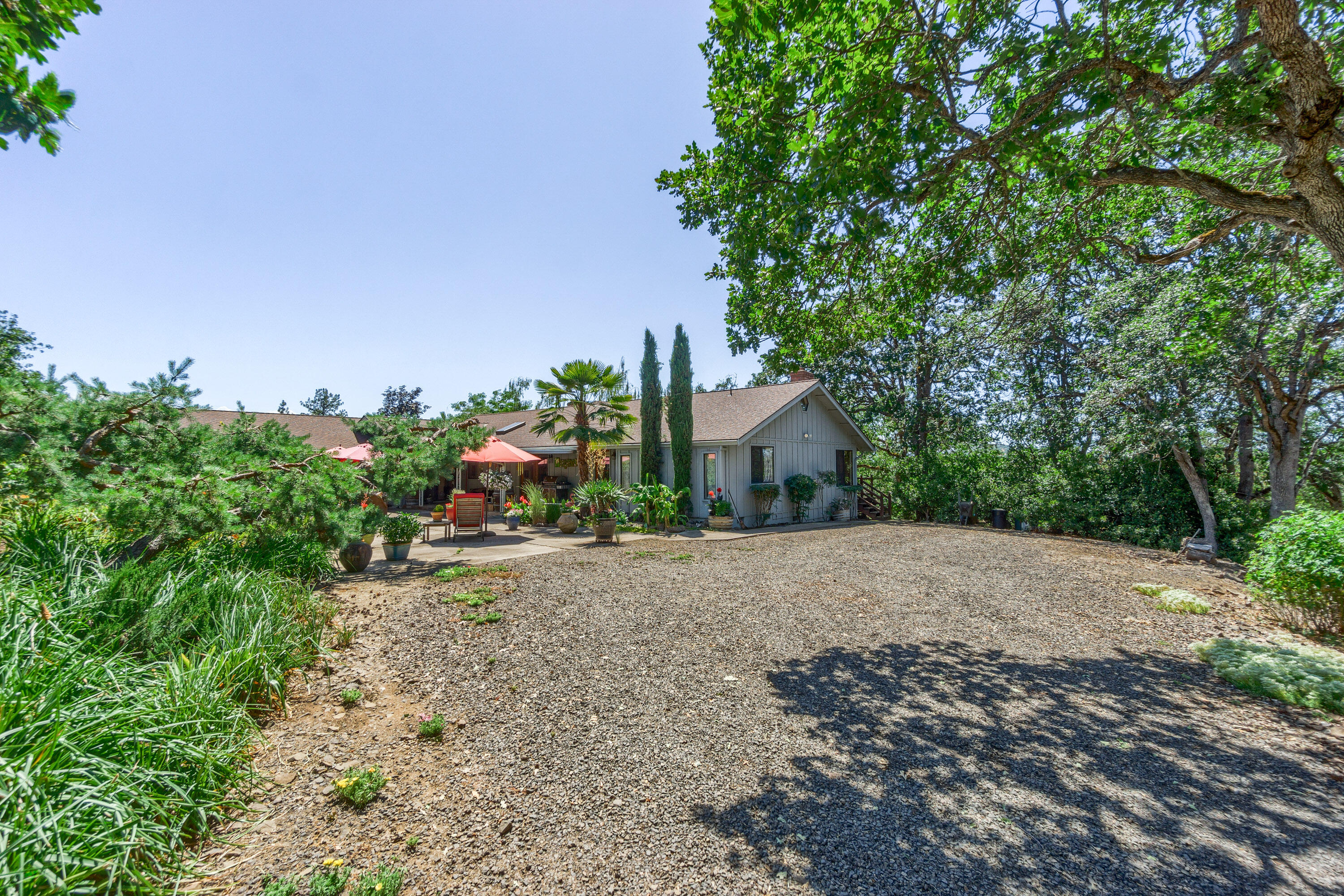 3000 Meridian Road Eagle Point, OR 97524 - Photo 21 of 53 a front view of a house with a yard and a tree