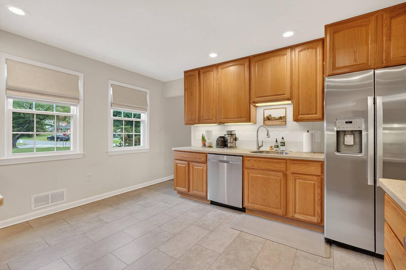 500 Finsbury Road Silver Spring, MD 20904 - Photo 8 of 54 a kitchen with granite countertop stainless steel appliances a refrigerator sink and microwave