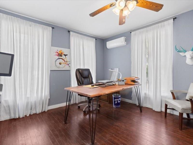 809 East Adams Street Itasca, TX 76055 - Photo 12 of 31 a view of a workspace with furniture window and wooden floor